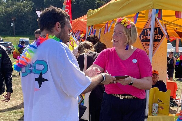 Zöe Franklin with petition signer at Pride in Surrey 2023