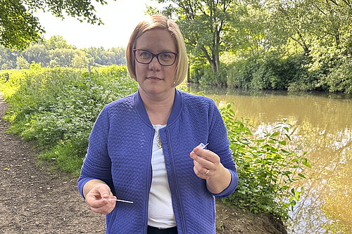 Zöe Franklin testing water from the River Wey