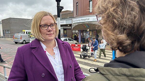 Zoe talking to a member outside Royal Surrey Hospital